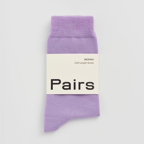 Purple sock with 'Pairs' label on a white background