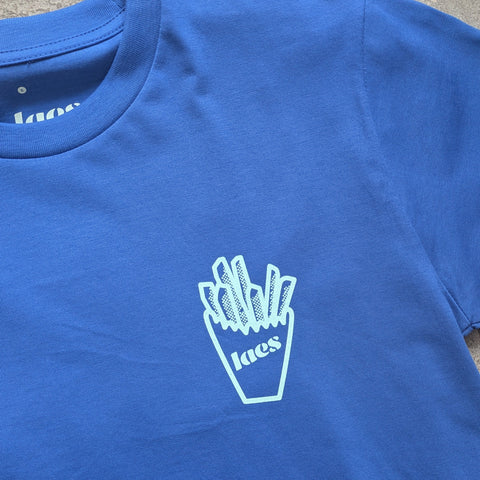 Blue t-shirt with a white graphic of fries and 'laes' branding on a concrete surface.