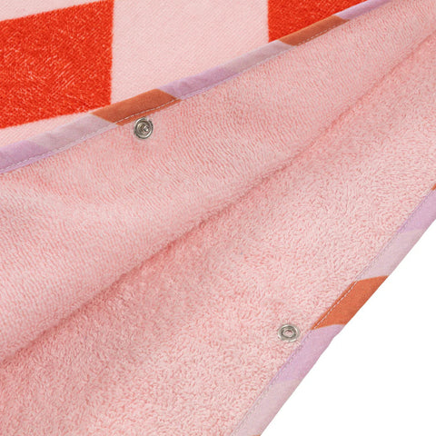 Close-up of a pink fabric with a checkered pattern on a white background