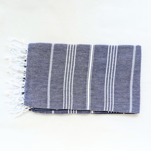 navy blue towel with white stripes on a white background