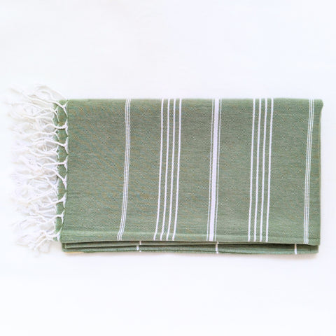 green towel with white stripes on a white background